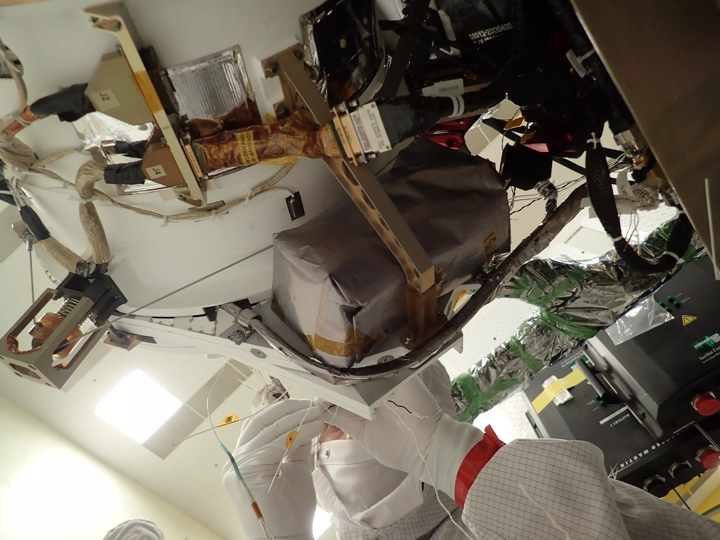 Image of A technician works to install GMAG on the GOES-T spacecraft. 