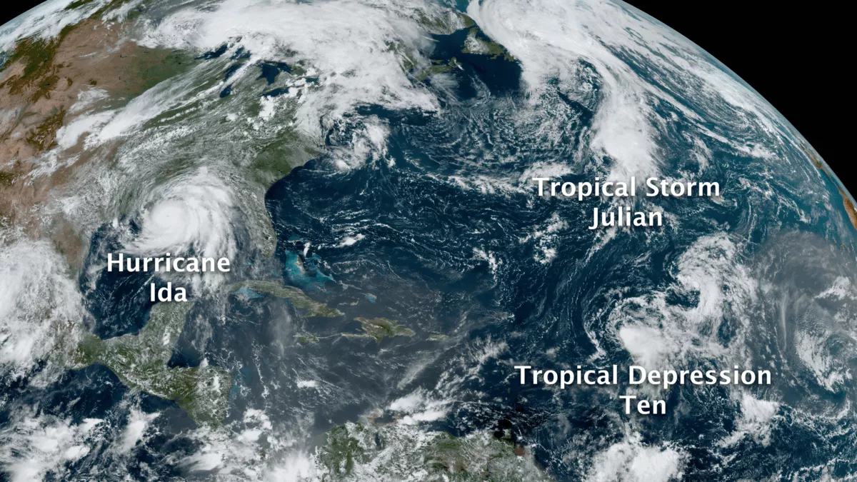 A view from the GOES East satellite shows Hurricane Ida prior to landfall, as well as Tropical Storm Julian and Tropical Depression Ten over the Atlantic.