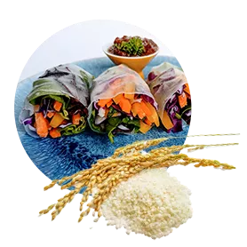 Vignette photo of prepared food rolls with grouping of rice husks and grain