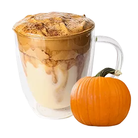Glass mug with creamy latte and a small pumpkin